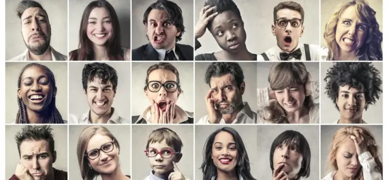 Grid of faces pulling a range of expressions, from delight to confusion and disgust