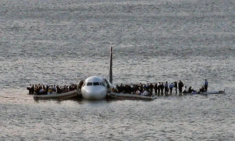 Passengers standing on the wings of US Airways Flight 1549 after it landed on the Hudson River