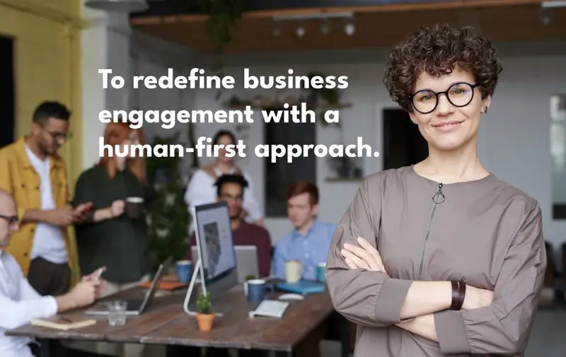 Vision statement graphic over a smiling team leader: To redefine business engagement with a human-first approach.